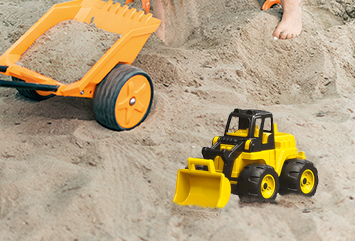 Radlader Spielzeug Radlader steht im Sand